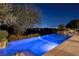 Enjoy evening swims in a sparkling, lit pool, with views of the vibrant cityscape in the distance at 641 Saint Croix St, Henderson, NV 89012