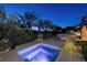 Relax in the spa with landscape and city views, complemented by nearby seating and lush greenery at 641 Saint Croix St, Henderson, NV 89012