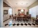 Formal dining room with a large table, hardwood floors, and a chandelier at 6632 Blue Hawaii Ave, Las Vegas, NV 89110