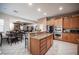 Modern kitchen with an island, stainless steel appliances, and wooden cabinets at 6632 Blue Hawaii Ave, Las Vegas, NV 89110