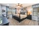 Serene main bedroom with a ceiling fan, large windows, and elegant furnishings at 664 Orchard Course Dr, Las Vegas, NV 89148