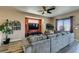 Living room with sectional sofa and decorative wall features at 7010 Salt Marsh Ct, Las Vegas, NV 89148