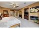 Spacious Primary suite with large bed, TV and fireplace at 7333 Gran Paradiso Dr, Las Vegas, NV 89131