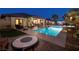 Luxury backyard oasis with a pool and fire pit at 7333 Gran Paradiso Dr, Las Vegas, NV 89131