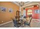 Bright dining room with a glass table and four chairs at 741 Antelope Ave, Pahrump, NV 89060