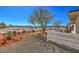 Landscaped front yard with desert plants, gravel, and a white fence at 741 Antelope Ave, Pahrump, NV 89060