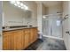 Bathroom with double sinks, granite countertop, and a separate shower at 8805 Jeffreys St # 1115, Las Vegas, NV 89123