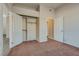 Bedroom with double door closet and view of another room at 8805 Jeffreys St # 1115, Las Vegas, NV 89123