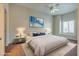 Virtually staged main bedroom with plush bedding and nightstands at 8805 Jeffreys St # 1115, Las Vegas, NV 89123