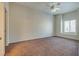 Spacious bedroom with ceiling fan and large window at 8805 Jeffreys St # 1115, Las Vegas, NV 89123