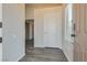 Bright entryway with laminate flooring, neutral walls, and an interior door at 8805 Jeffreys St # 1115, Las Vegas, NV 89123