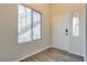 Modern entryway featuring laminate flooring and a view of an interior staircase at 8805 Jeffreys St # 1115, Las Vegas, NV 89123