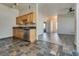 Kitchen with wood cabinets, granite countertops, and stainless steel appliances at 8805 Jeffreys St # 1115, Las Vegas, NV 89123