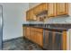 Kitchen boasts wood cabinets, granite counters, and stainless steel appliances at 8805 Jeffreys St # 1115, Las Vegas, NV 89123