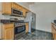 Modern kitchen with stainless steel appliances and wood cabinets at 8805 Jeffreys St # 1115, Las Vegas, NV 89123