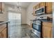 Modern kitchen features stainless steel appliances and a tile floor at 8805 Jeffreys St # 1115, Las Vegas, NV 89123