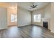 Open living room with hardwood floors, fireplace, and access to other rooms at 8805 Jeffreys St # 1115, Las Vegas, NV 89123