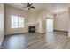 Spacious living room showcasing a fireplace and hardwood floors at 8805 Jeffreys St # 1115, Las Vegas, NV 89123