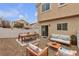 Backyard patio showcasing outdoor furniture including a dining table and cushioned seating area at 9323 Leaping Deer Pl # 102, Las Vegas, NV 89178