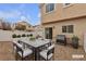Cozy backyard patio with dining and lounging area, perfect for outdoor entertaining at 9323 Leaping Deer Pl # 102, Las Vegas, NV 89178