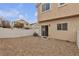 Backyard of the home has a white fence and gravel ground cover at 9323 Leaping Deer Pl # 102, Las Vegas, NV 89178