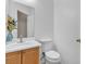 Well-lit half bath with a modern sink and a decorative vase with flowers at 9323 Leaping Deer Pl # 102, Las Vegas, NV 89178