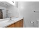 Bathroom features a wide mirror over a single sink vanity at 9323 Leaping Deer Pl # 102, Las Vegas, NV 89178