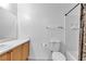Bathroom showcasing a toilet and tiled shower/bathtub with bronze shower curtain at 9323 Leaping Deer Pl # 102, Las Vegas, NV 89178