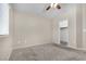 Bedroom with neutral carpet and bright window with a view at 9323 Leaping Deer Pl # 102, Las Vegas, NV 89178