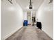 Clean two car garage featuring bright lighting, a back door and ample room for storage at 9323 Leaping Deer Pl # 102, Las Vegas, NV 89178