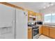 Bright kitchen featuring modern appliances, ample cabinetry, and stylish finishes at 9323 Leaping Deer Pl # 102, Las Vegas, NV 89178