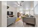Spacious living room with modern decor, light-colored flooring, and neutral-toned walls at 9323 Leaping Deer Pl # 102, Las Vegas, NV 89178