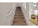 Carpeted staircase leading to the upper level of the home at 9323 Leaping Deer Pl # 102, Las Vegas, NV 89178