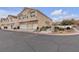 Attractive townhome with garages, manicured landscaping, and street parking at 9323 Leaping Deer Pl # 102, Las Vegas, NV 89178