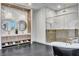 Spa-inspired bathroom with double vanity and walk-in shower at 9408 Players Canyon Ct, Las Vegas, NV 89144