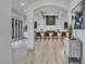 Open concept hallway with kitchen view and wood floors at 9408 Players Canyon Ct, Las Vegas, NV 89144