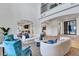 Living room with views of the kitchen and backyard at 9408 Players Canyon Ct, Las Vegas, NV 89144