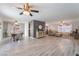 Open concept living space featuring modern gray flooring, neutral paint tones, and abundant natural light at 9528 Chanticleer Ct, Las Vegas, NV 89129