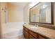 Bathroom featuring a tub, shower, and vanity with granite counters at 10233 King Henry Ave # 203, Las Vegas, NV 89144