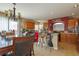 Kitchen with a breakfast bar, wooden cabinets, and a dining area at 10920 Fishers Island St, Las Vegas, NV 89141