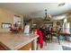 Kitchen with an island, wooden cabinets, and a dining area at 10920 Fishers Island St, Las Vegas, NV 89141