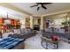 Living room with two sofas, a coffee table, and a view of the kitchen at 10920 Fishers Island St, Las Vegas, NV 89141