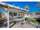 Outdoor back patio featuring a pergola, stamped concrete, stainless grill, and outdoor seating at 11268 Lavandou Dr, Las Vegas, NV 89141