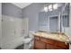 Well-lit bathroom featuring a vanity with granite countertops and a shower-tub combo at 11268 Lavandou Dr, Las Vegas, NV 89141