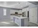 Modern kitchen featuring white cabinetry, a central island, and stainless steel appliances at 11268 Lavandou Dr, Las Vegas, NV 89141