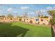 Artificial turf backyard with decorative wall and string lights at 1134 Edel Hest Ave, North Las Vegas, NV 89081