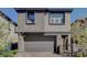 Modern two-story home with attached garage and neutral color scheme at 12525 Lylan Ridge St, Las Vegas, NV 89138