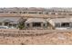 Aerial view of homes with desert landscape and mountains in background at 144 Stone Mesa Ct, Henderson, NV 89011