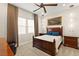 Spacious bedroom with a large bed, wood furniture, and neutral color scheme at 144 Stone Mesa Ct, Henderson, NV 89011