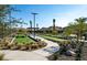 Outdoor bocce ball courts with landscaping and pathway at 144 Stone Mesa Ct, Henderson, NV 89011